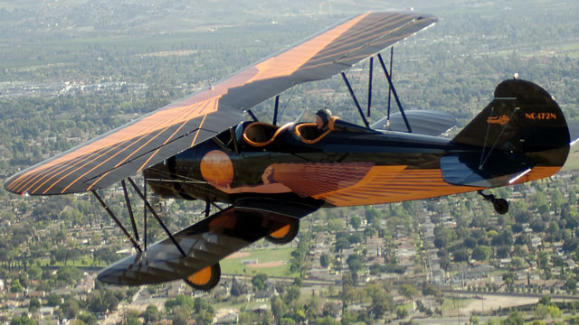 Richard Zeiler’s 1929 Travel Air D4D “Sky Siren” over Riverside, California. Photo courtesy of Richard Zeiler.