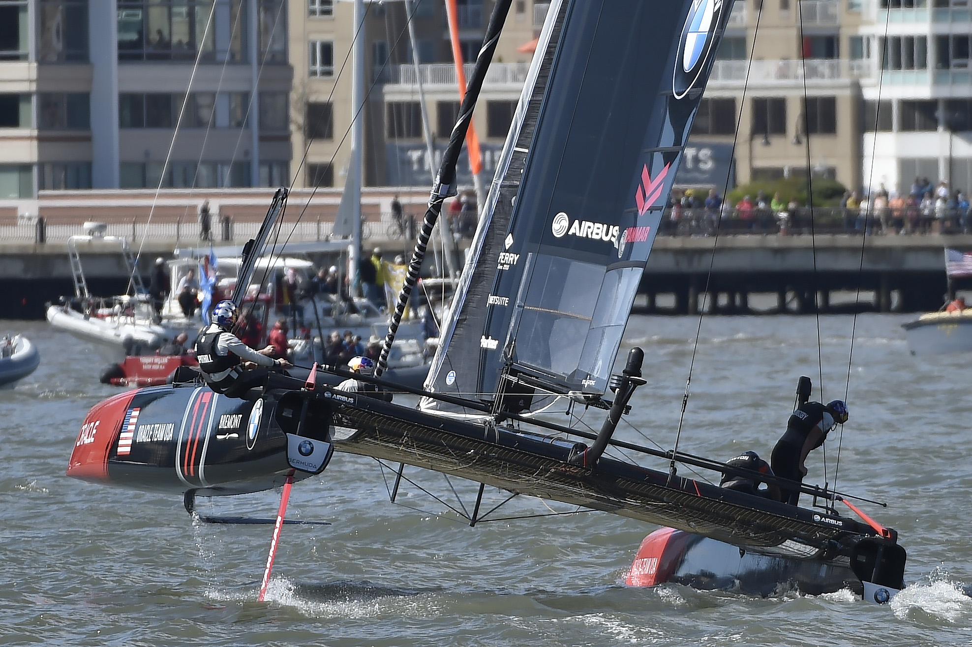 Oracle Team USA skipper Jimmy Spithill leans overboard away from the rigid sailing wing during a Louis Vuitton America's Cup World Series preliminary race in New York City. Photo by David Tulis.                                                                                   