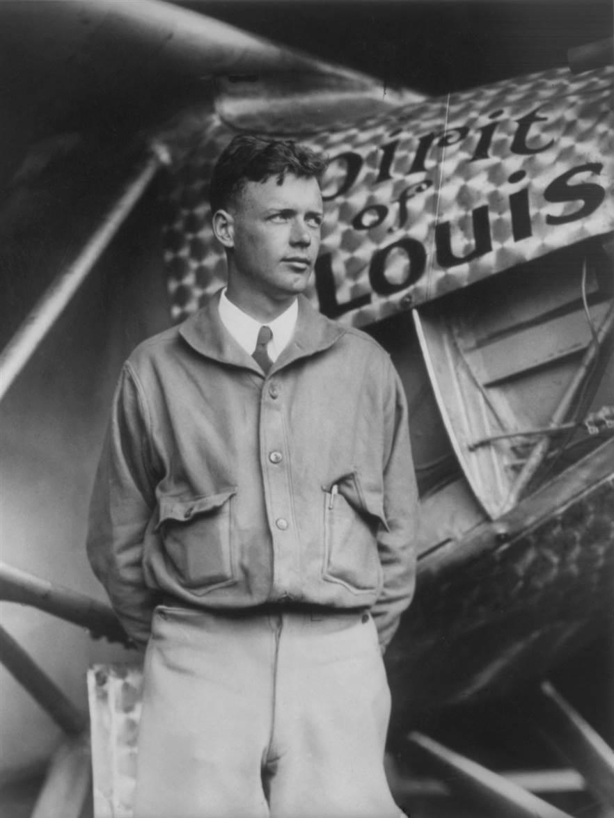 Charles Lindbergh, with Spirit of St. Louis in background. Restored by Crisco 1492 from File:Charles Lindbergh and the Spirit of Saint Louis.tif (removed dust, scratches, including black spots on the wings which may or may not have been there in the original).