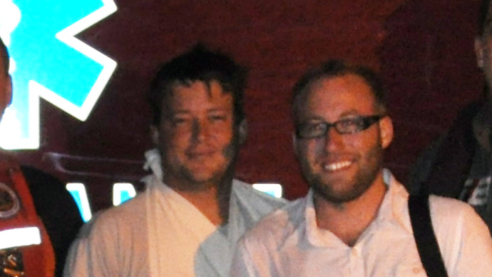 Theodore R. Wright, right, and Raymond Fosdick posed for photos with their rescuers after ditching in the Gulf of Mexico in September 2012. U.S. Coast Guard Photo (cropped). 