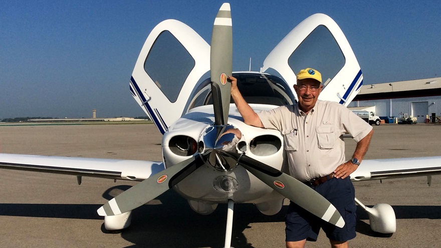 Stephen Coonts and the 2003 Cirrus SR22 he acquired to resume flying under BasicMed. Photo courtesy of Stephen Coonts.