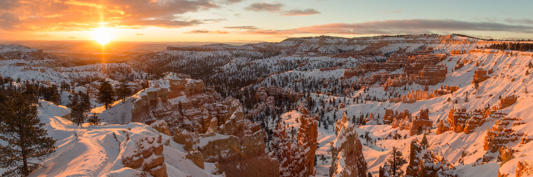 This panoramic view of Bryce Canyon at sunrise proves the park is at least as beautiful in winter as it is in summer. Photo by Wenjie Qiao via Flickr.