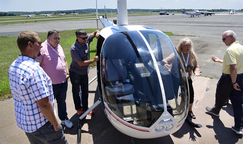 Helicopter pilot and educator Cathleeen Perdok describes rotor wing procedures to fellow high school teachers learning about hands-on tenth-grade aviation curriculum that uses science, technology, engineering, and math concepts to teach youth about aviation and aerospace at the AOPA You Can Fly Academy in Frederick, Maryland, July 10, 2018. Photo by David Tulis.