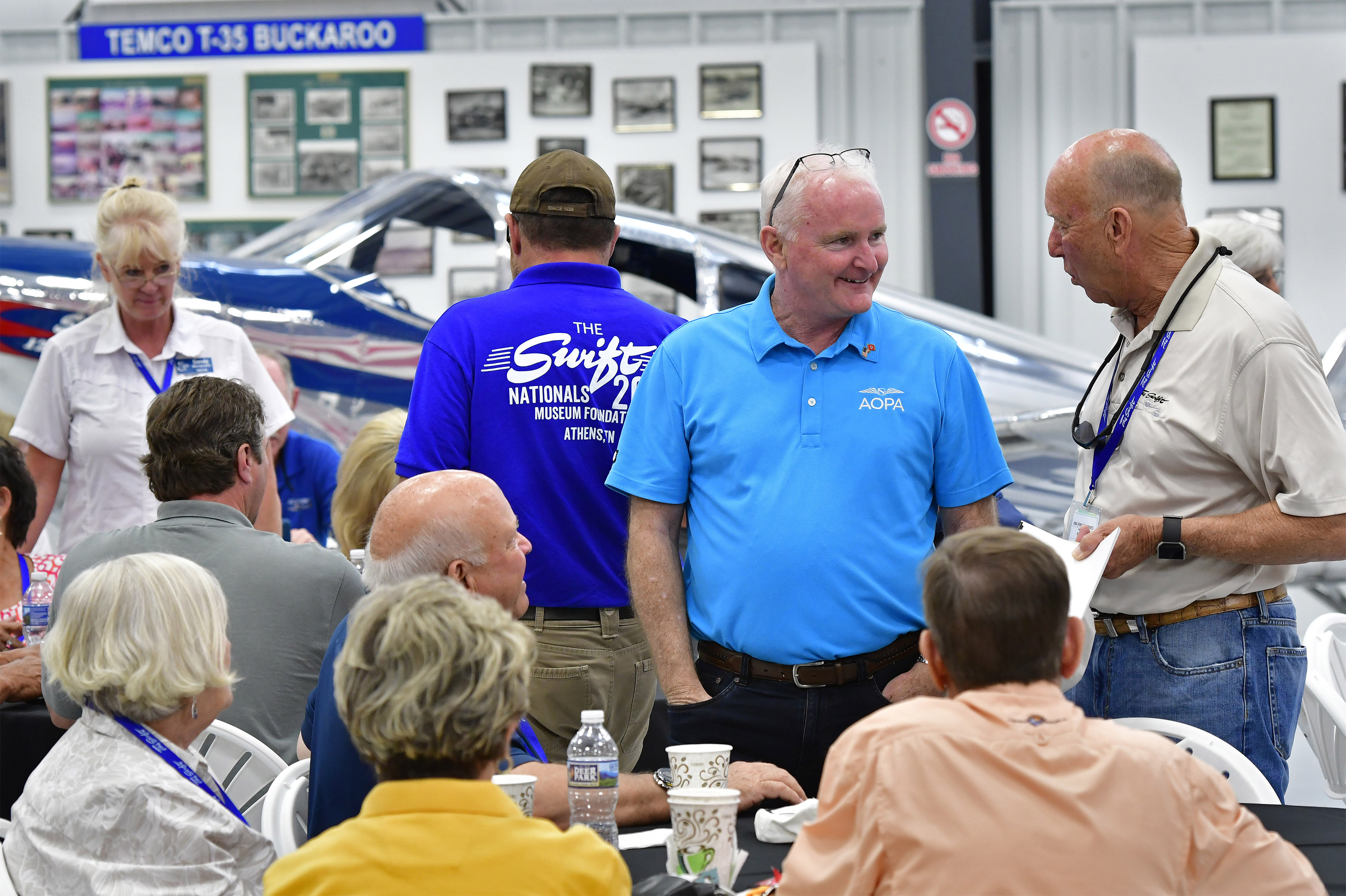 AOPA President Mark Baker meets with Jim 'Frog' Jones and other Swift aircraft pilots during the 2018 Swift National fly-in to help celebrate the fiftieth anniversary of the Swift Museum Foundation, in Athens, Tennessee, June 7 to 10. Photo by David Tulis.