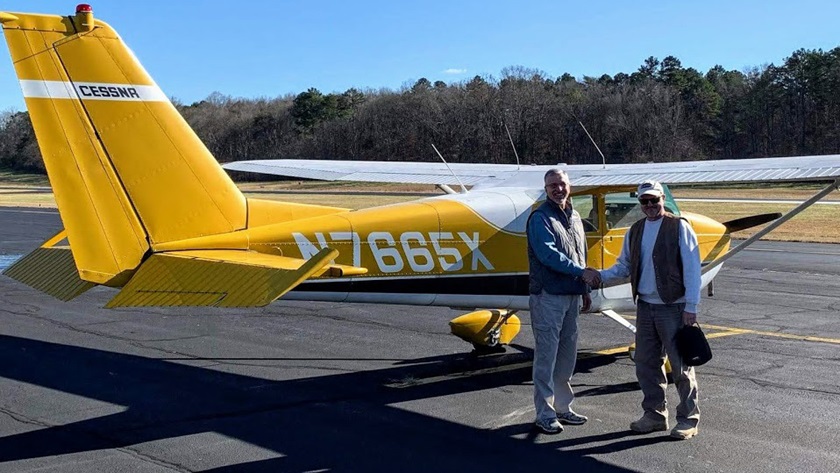 George Gillett, left, is congratulated on earning his instrument rating by designated pilot examiner Greg Hudson. Photo courtesy of George Gillett.