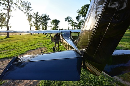 Pilots Josh Buchsbaum and Ryan McCormack (not pictured) park their Cessna 150 in the trees before camping out during the Young Aviators Fly-In at Triple Tree Aerodrome in Woodruff, South Carolina. Photo by David Tulis.