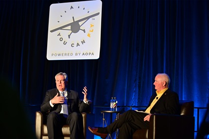 Keynote speaker and United Airlines Flight Operations Senior Vice President Bryan Quigley, left, discusses flight training leadership with AOPA President Mark Baker. Photo by David Tulis.