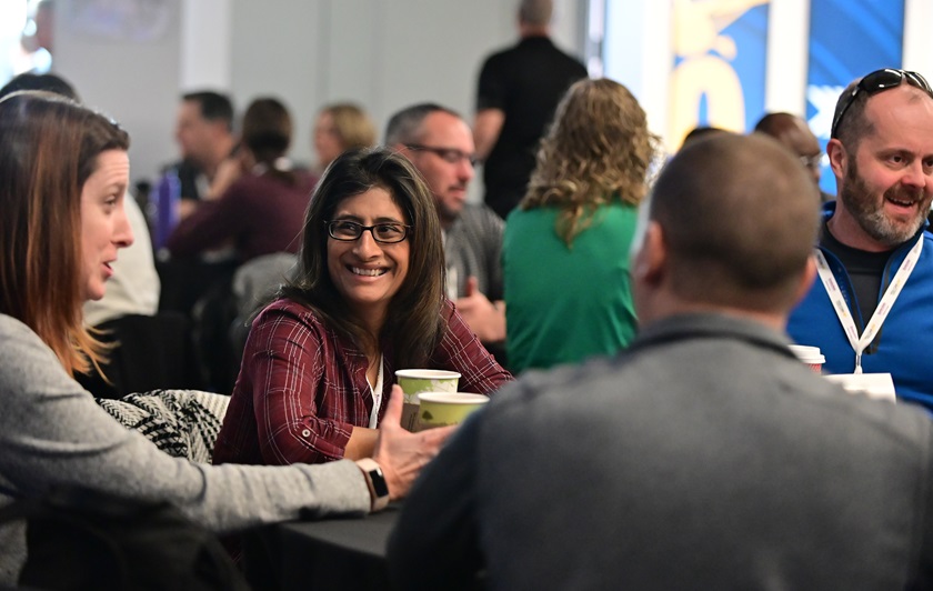 Educators socialize during the 2019 AOPA High School Aviation STEM Symposium in Denver. The 2020 event will be held virtually beginning November 17. Photo by David Tulis.