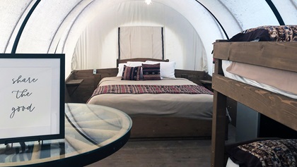 Conestoga wagons at the Orr Family Farm in Oklahoma feature a king bed and either one or two sets of bunk beds, as well as a table, microwave, refrigerator, overhead lights, five electrical outlets, and heating and cooling. Photo by MeLinda Schnyder.