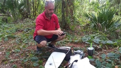 Prepping the gear for the flight through the woods. Photo by Matthew Lamont Burgess.