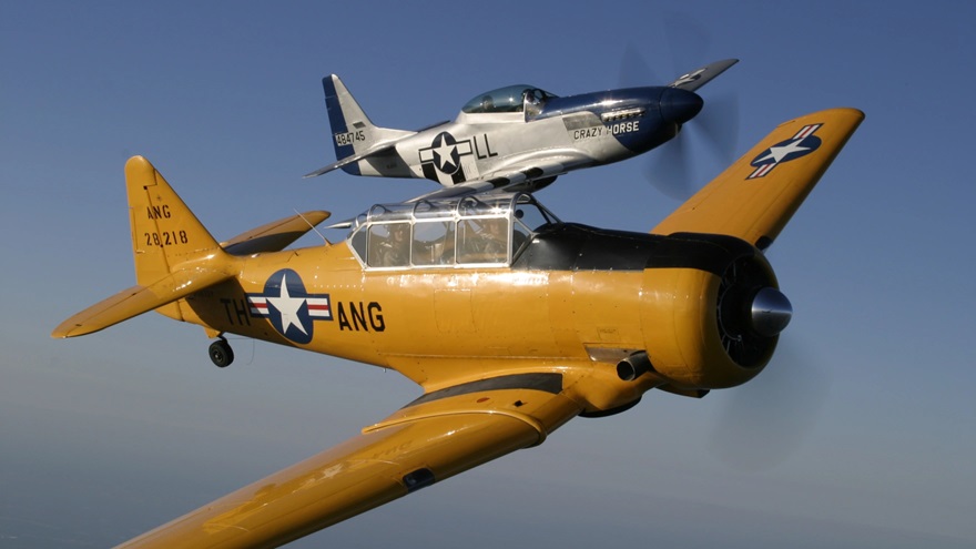 Stallion 51’s T-6 Texan and TF-51 Mustang that will be part of the World War II flight experience. Photo by Paul Bowen.