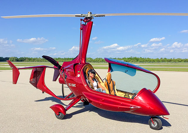 Katherine Jimenez Romero, from Colombia, and a recent law school graduate is taking a vacation at Sun ‘n Fun before starting her career as a lawyer. She spotted the ELA Aviación G10 Eclipse gyroplane, which is making its debut in the United States at Sun 'n Fun. Photo by Rob Rollison.