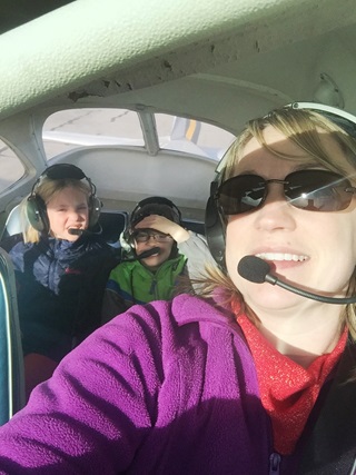 Stephanie Stechschulte shares the joy of her new pilot certificate with daughter Abby and son Kevin.