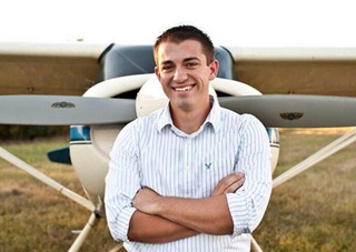 Middle Tennessee State University honors student Collin McDonald stands in front of his family's Maule MX7-160 aircraft.