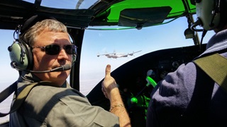 Mid America Flight Museum Managing Director Scott Glover escorts Columbine II aboard the B-25 “God and Country” as the former Air Force One heads east. Photo courtesy of Mid America Flight Museum