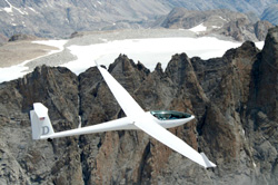 Glider in mountains