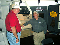 Air Mod's Dennis Wolter (right) with a customer.