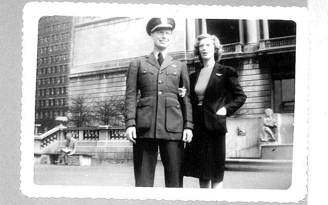 Mitchell Flint dressed in Navy aviation greens posed with his mother for a photo.