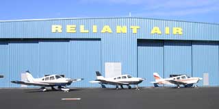 Planes in front of hangar