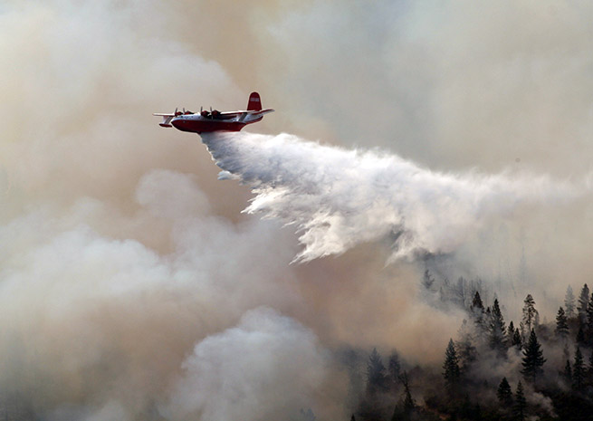 The Martin Mars drops about 7,000 gallons on the Motion Fire in California in July 2008. Photo courtesy of Coulson Flying Tankers.