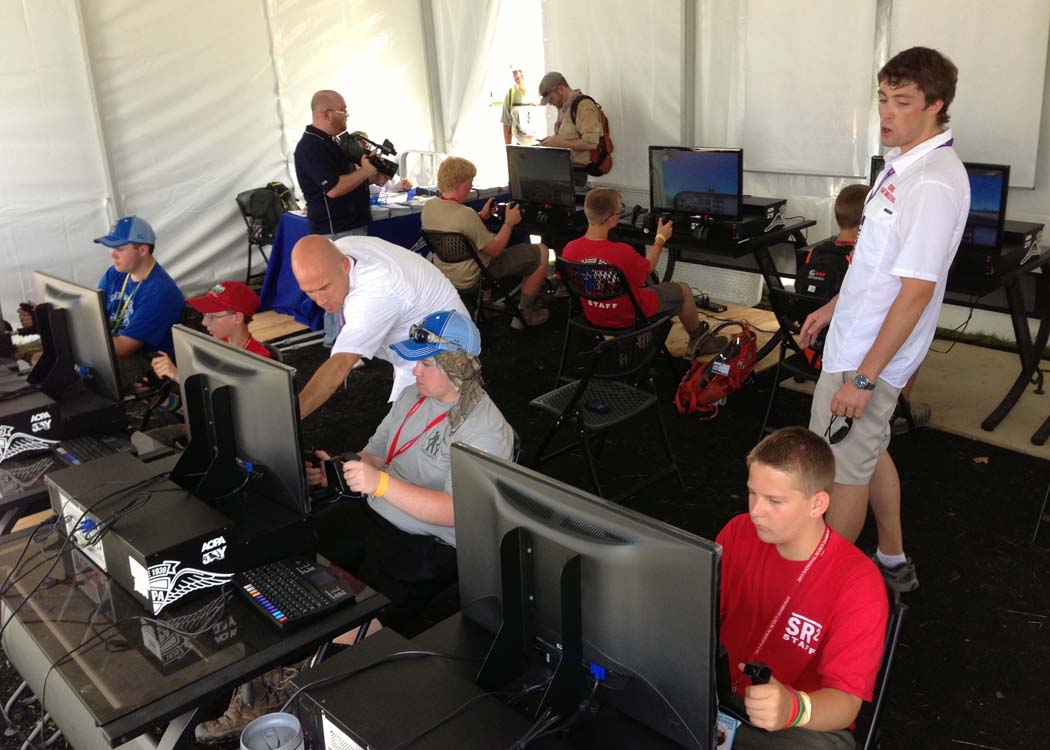 Scouts flood the AOPA tent to fly the AOPA Jay by Redbird.