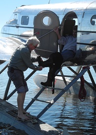 By the end of the trip, camaraderie abounds. Greg Herrick pulls waders off of Nikali Pontecorvo after beaching at Lake Eufaula in southern Alabama.