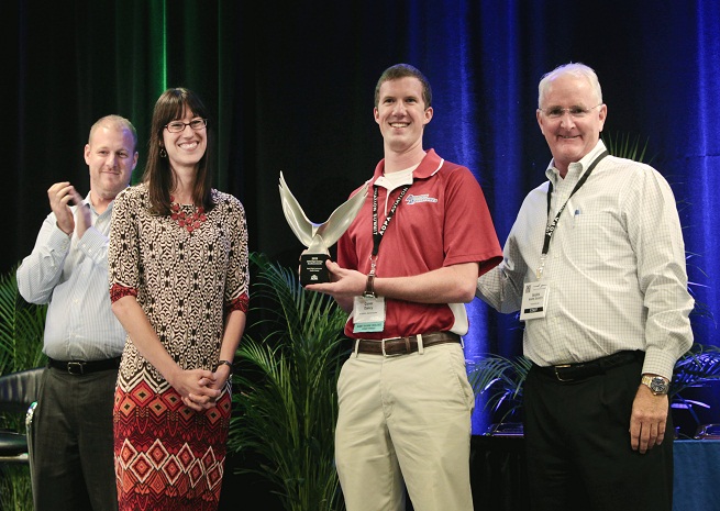 Flight Training Excellence Award winner Conor Dancy accepts his award at AOPA Aviation Summit.