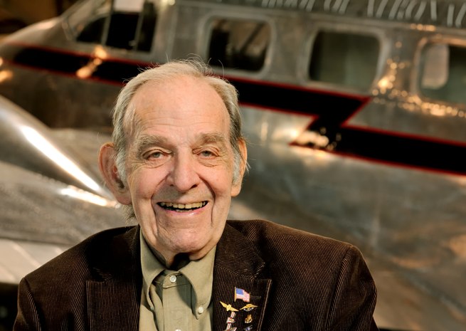 Clancy Hess poses with Lewis University's Twin Beech at Lewis University Airport in Romeoville, Ill., near Chicago.