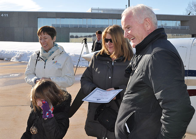 AOPA President Mark Baker gave Susan Gray and her daughter Esther Harbin (center) their first GA experience. Women of Aviation Worldwide Week founder Mirielle Goyer is standing at left. 