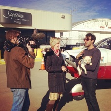 Phillip Angert (right) holds Yoshi as he talks to a news crew from a local Wichita TV station. (Photo courtesy Phillip Angert)