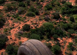 The red dust throughout the Tsavo region of Kenya is colored in part by volcanic ash. It is highly corrosive when ingested into engines.