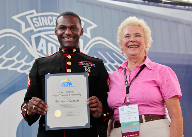 Rodney McKnight (left), winner of the 2013 Ceci Stratford Flight Training Scholarship, has earned his private pilot certificate. Shown here with Ceci Stratford at AOPA Aviation Summit.