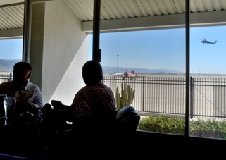 Large windows offer a view of airport traffic.