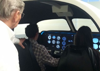 Stephen Cunningham of Nashua Flight Simulator coaches as Daniel Webster College students get a taste of hands-on IFR. Photo courtesy of Nashua Flight Simulator. 