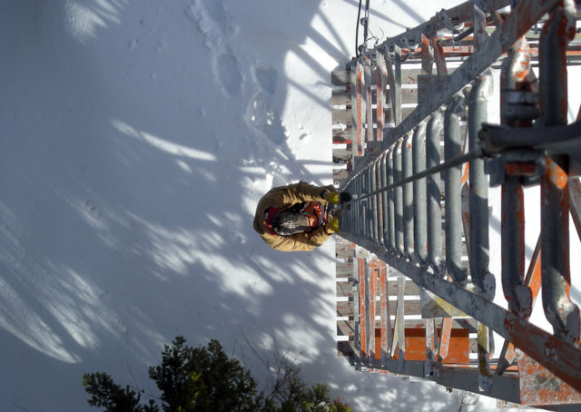 Climbing towers that can exceed 100 feet to change lightbulbs is not for the faint of heart. Photo courtesy of Mike Rogan, Montana DOT Aeronautics Division. 