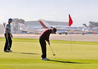 The 16th green at Salinas Fairways Golf Course offers views of the FBO ramp.