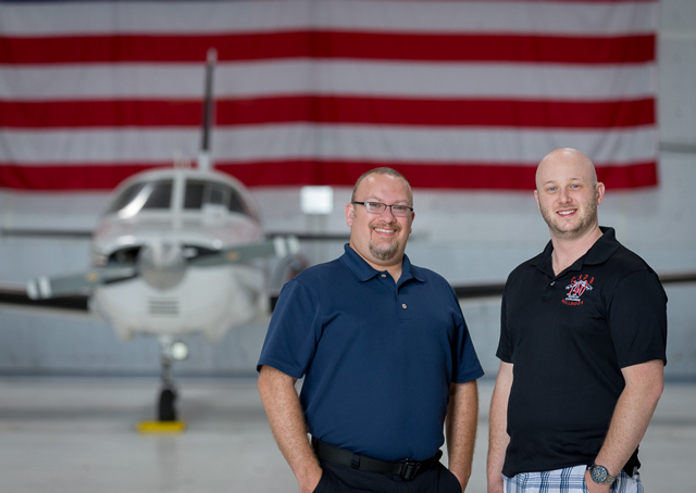 Todd Barker (left) and Anthony Thomas, both deaf pilots, met at Colorado Springs and now work together at Peak Aviation Center. Photo by Mike Fizer.