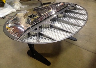 A Beechcraft C-45 rudder lives on as a desk and a conversation piece, and is also available in its original satin finish, starting at $6,900. The polished piece as shown is $8,900. Photo courtesy of MotoArt.