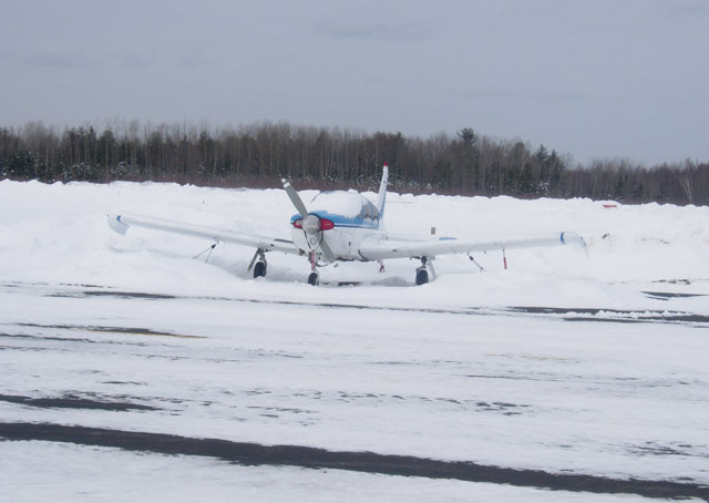 When the snow measures in the feet, make sure to take care of your airplane! This snow-covered aircraft is based at Dewitt Field, Old Town Municipal Airport in Old Town, Maine. Photo by Dan Namowitz.