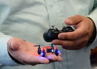 A participant holds a micro drone at the UAS Academy in Warrenton, Virginia. Photo by David Tulis.