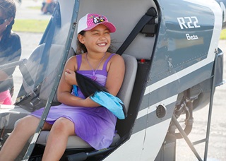 What a grin—looks like a future helicopter pilot! Photo by Chris Rose.