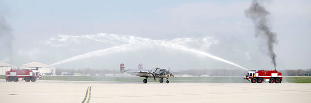 The B-25 "Panchito" taxis through a water cannon at Wright-Patterson Air Force Base in Dayton, Ohio, to deliver the Congressional Gold Medal to surviving Doolittle Tokyo Raiders Richard Cole and David Thatcher. Photo courtesy of the National Museum of the U.S. Air Force.
