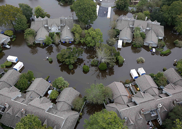 Homes in a subdivision west of the Ashley River in Charleston, South Carolina, are surrounded by floodwater Oct. 5. Photo courtesy of AP/Mic Smith.