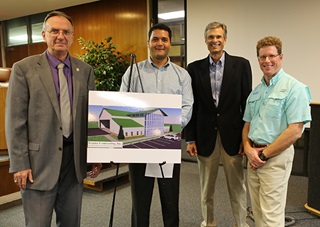 The Winter Haven City Council approved a lease for the Seaplane Pilots Association's new headquarters site during a meeting Oct. 13. Left to right, Merle Bishop, Growth Management Director for the City of Winter Haven; Leo Treggi, Airport Director; Phil Lockwood, SPA Foundation Chairman; and Steve McCaughey, SPA Foundation Executive Director. Photo courtesy of Mark Twombly.