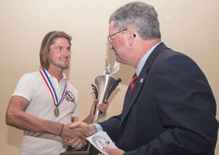 Eric Lentz-Gauthier accepts his glider national champion's trophy from IAC President Mike Heuer Sept. 25. Jim Moore photo.