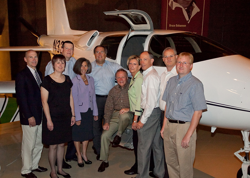 EAA and AOPA leaders gather at the EAA Aviation Center in Oshkosh,  Wis., on June 3.&nbsp; Shown in front of the Cirrus VK-30 prototype are  (from left): Andy Cebula, AOPA executive vice president of government  affairs; Karen Gardinier, EAA vice president of human resources; Rick  Larsen, EAA vice president of marketing and communications; Elissa  Lines, EAA vice president of development; Craig Fuller, AOPA president;  Tom Poberezny, EAA chairman/president; Karen Gebhart, AOPA executive  vice president of communications; Bruce Landsberg, president of the  AOPA Air Safety Foundation; Earl Lawrence, EAA vice president of  industry and regulatory affairs; Adam Smith, EAA vice president,  membership.