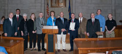 From left to right: Bob Joyce, manager of Silverhawk Aviation, LNK; Steve Gade, vice president of sales and marketing, Duncan Aviation; Diane Bartels, Ninety-Nines, Air Force Association; Andre Aman, deputy director, Nebraska Department of Aeronautics (NDA); Bill Lyon, operations division manager, NDA; Patsy Meyer, Ninety-Nines; David Morris, aviation specialist, NDA; Nebraska Gov. Dave Heineman; Ronnie Mitchell, NDA director; Dan Petersen, FAA assistant director, LNK office; Bill Heckathorn, Performance Aircraft Sales and Flight Training, LNK; and James Hilliard, Performance Aircraft Sales and Flight Training, LNK. 
