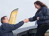AOPA President Craig Fuller congratulates Karoline Amodeo on winning the 2008 Get Your Glass Sweepstakes Piper Archer.