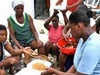 Food is distributed to hungry survivors.