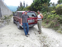 Carl I. Ross-Works and Derrick Quant, both of Navistar International, in the hills overlooking Port-au-Prince.